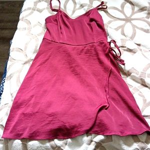 A dress with a stretchy back. It's maroon.